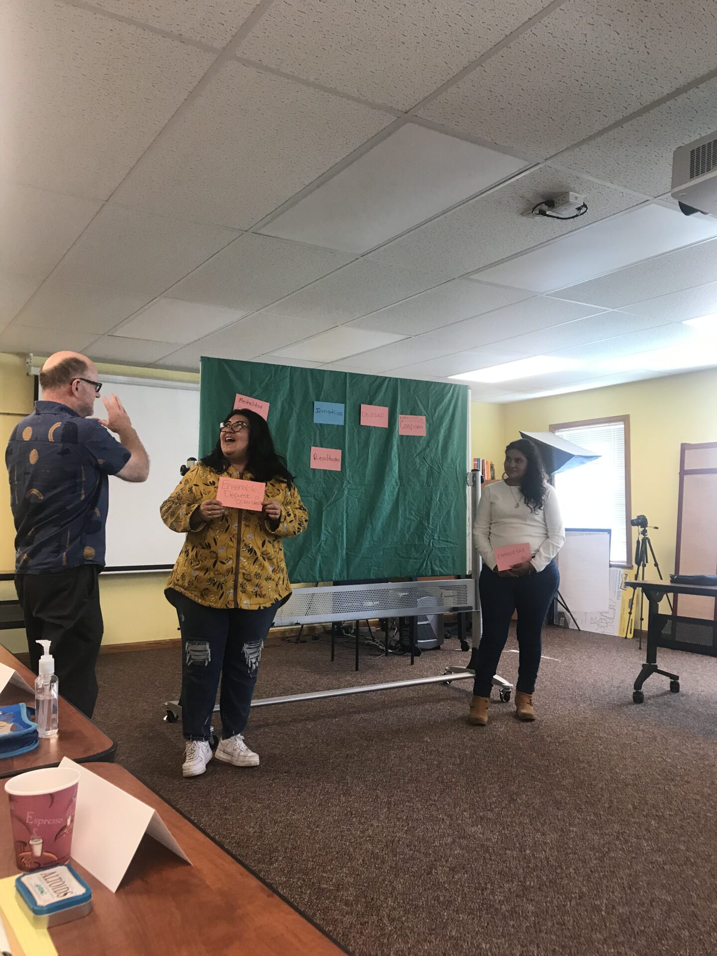 Three people getting ready to present