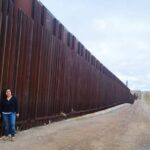 In front of a border wall